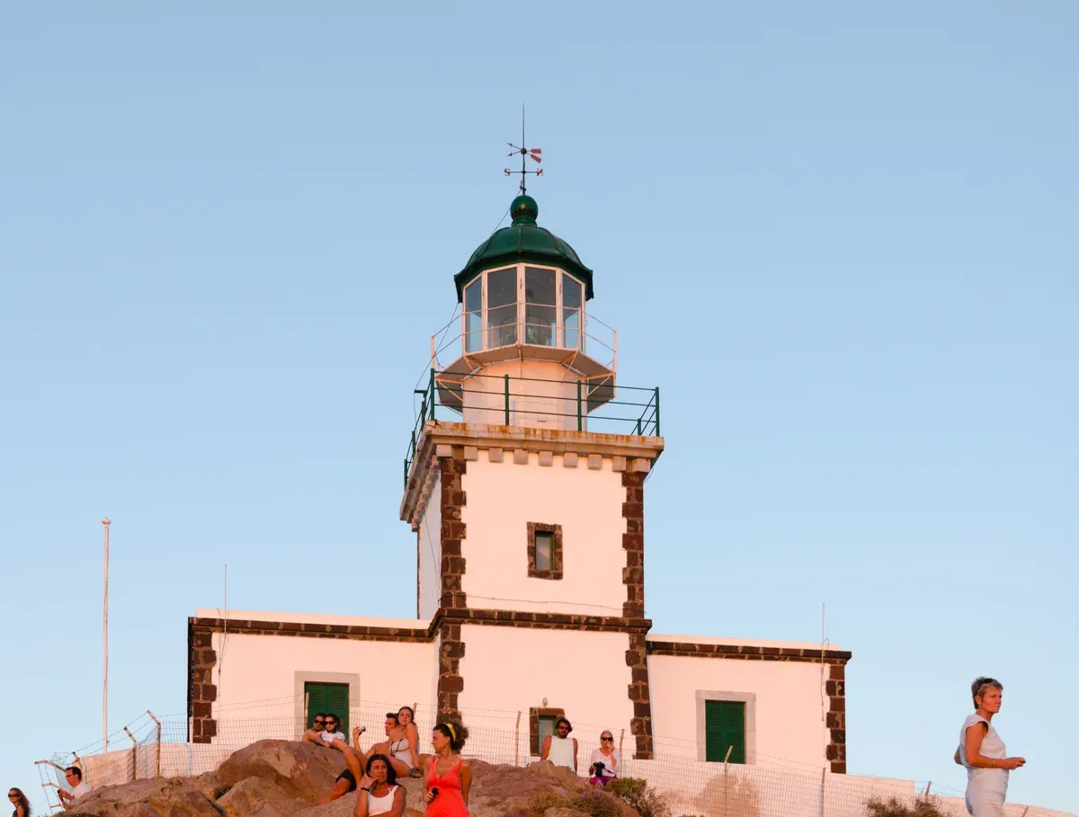 Akrotiri Lighthouse at the southwest tip, passed on a Santorini catamaran cruise
