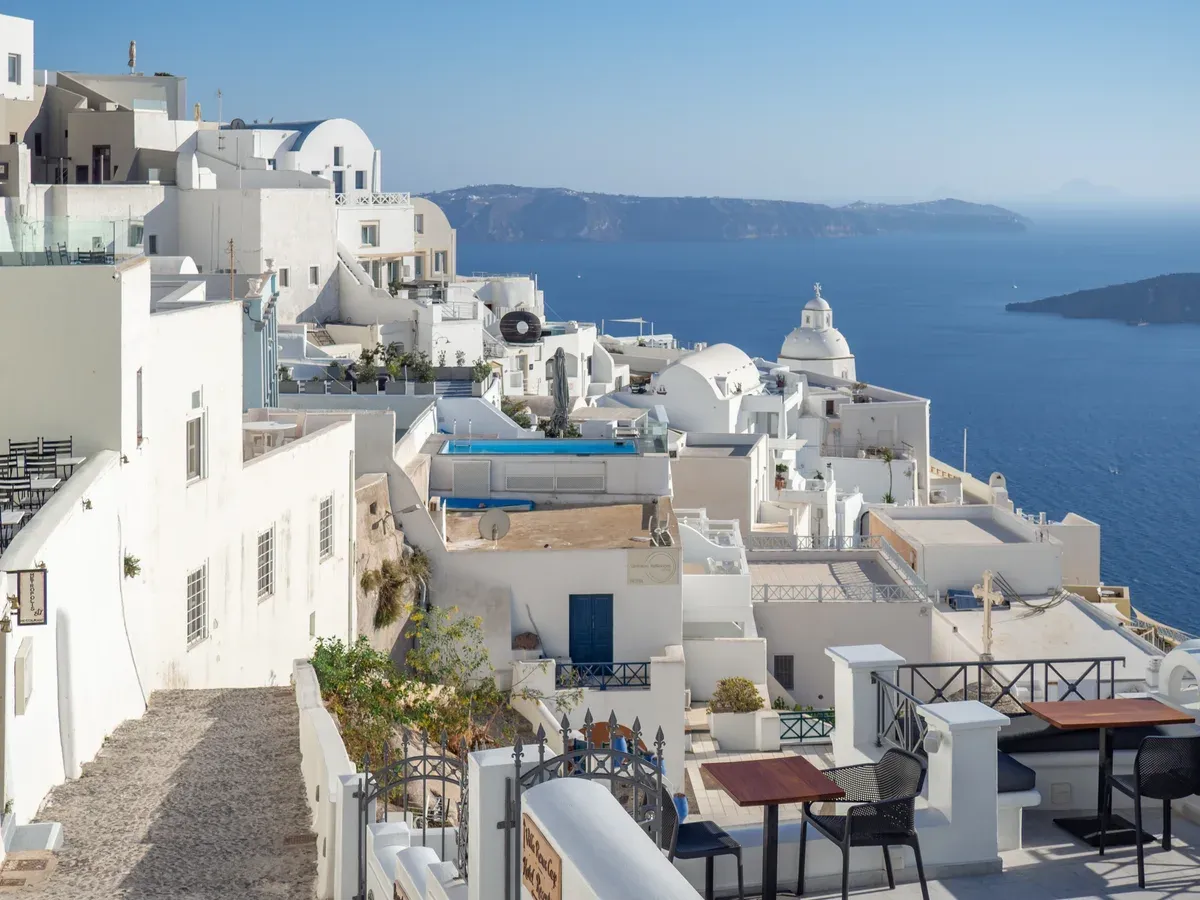 Whitewashed houses of Fira above the caldera, seen on a Santorini catamaran cruise itinerary